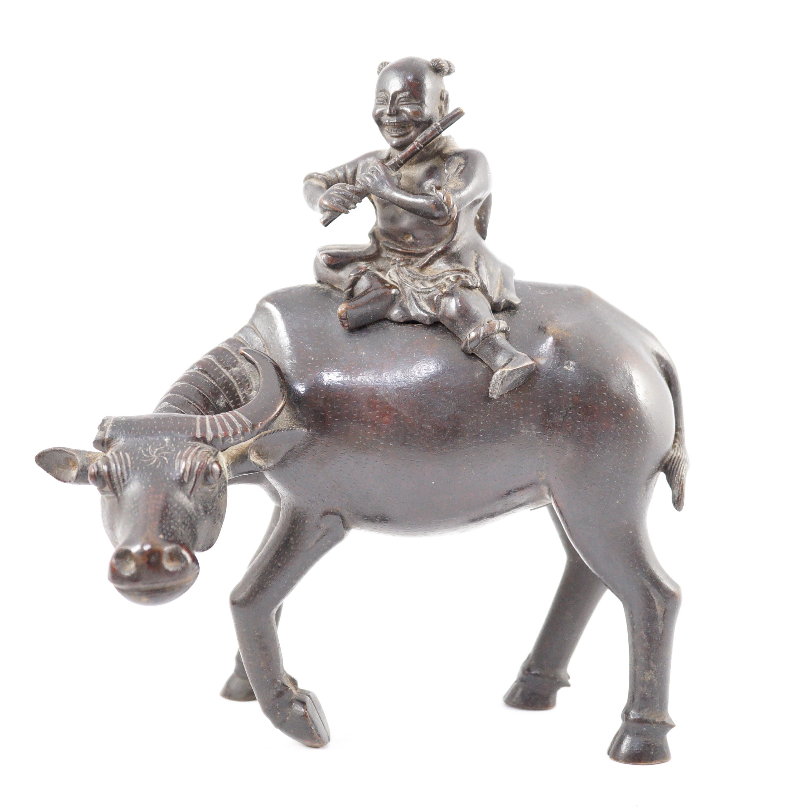 A Chinese bronze ‘boy riding a water buffalo’ censer, 17th/18th century, 22.5cm long, one horn detached but present